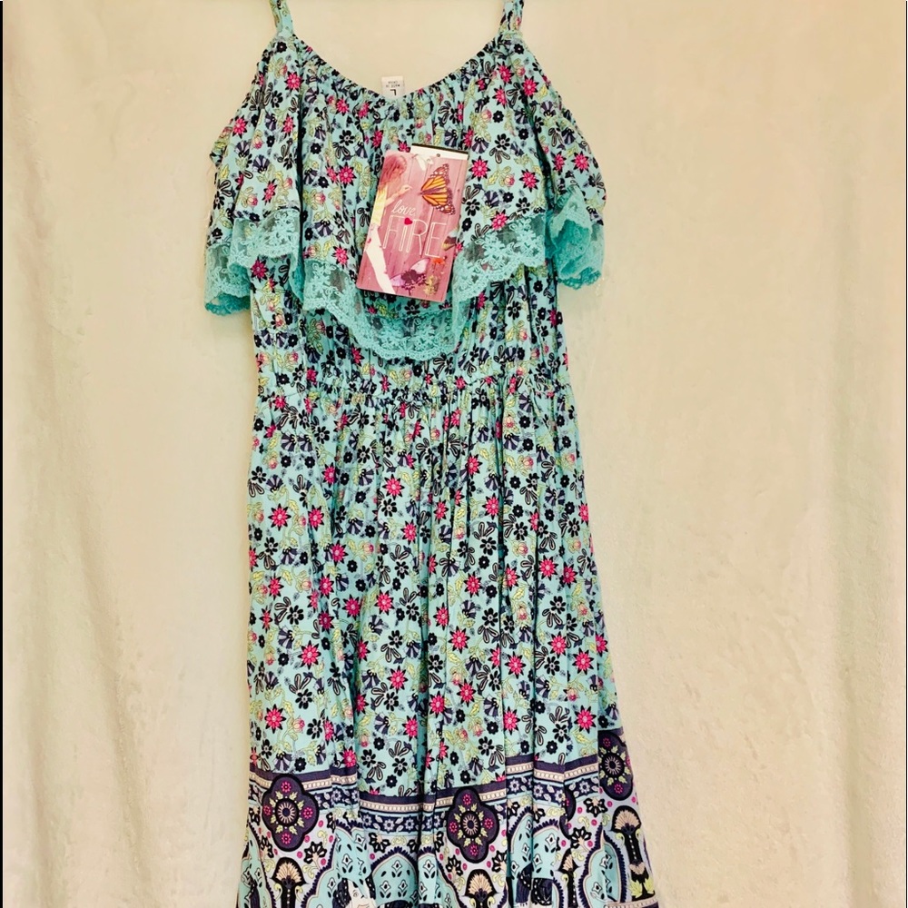 Dress with bright flowers and Lacey outline.